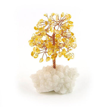 Citrine copper tree on white crystal base against white background for spiritual home decor.